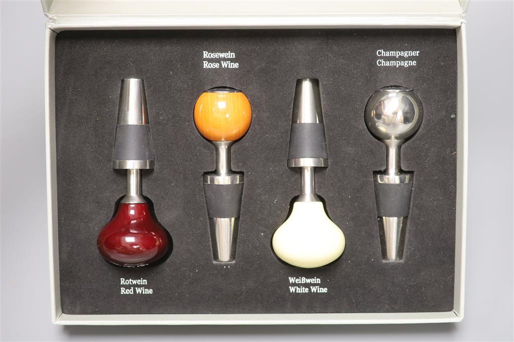 A cased novelty Mercedes Benz four-piece gear stick wine stopper set